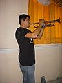 Hno. Evenecer Uriarte con la trompeta en el concierto.jpg